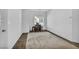 Large room that is decorated as a secondary bedroom, featuring carpet and a rug at 7348 N Decatur Blvd # 5, Las Vegas, NV 89131