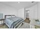A well-lit bedroom with a queen bed, a large closet with a sliding glass door, and a white dresser at 7348 N Decatur Blvd # 5, Las Vegas, NV 89131