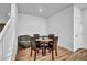 Dining area with stairs, hardwood floors, and a table set for four at 7348 N Decatur Blvd # 5, Las Vegas, NV 89131