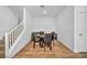 Dining area with stairs, hardwood floors, and a table set for four at 7348 N Decatur Blvd # 5, Las Vegas, NV 89131