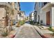Community street view showcasing contemporary townhomes and well-maintained landscaping in the neighborhood at 7348 N Decatur Blvd # 5, Las Vegas, NV 89131