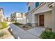 Attractive townhome exterior highlighting neat landscaping, a stone-accented facade, and a tidy walkway at 7348 N Decatur Blvd # 5, Las Vegas, NV 89131