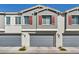 Exterior view of modern townhomes, highlighting the architecture, garages, and landscaping at 7348 N Decatur Blvd # 5, Las Vegas, NV 89131