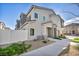Stylish townhome featuring a modern exterior, a well-kept lawn, and a welcoming entrance at 7348 N Decatur Blvd # 5, Las Vegas, NV 89131