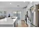 Spacious kitchen with island, stainless steel appliances, and modern lighting at 7348 N Decatur Blvd # 5, Las Vegas, NV 89131