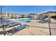 Resort-style community pool with lounge chairs and seating areas for relaxation and socializing at 7348 N Decatur Blvd # 5, Las Vegas, NV 89131