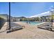 Community pool with ample seating surrounded by well-maintained landscaping at 7348 N Decatur Blvd # 5, Las Vegas, NV 89131