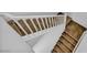 A carpeted staircase featuring white banisters connecting two levels of the home at 7348 N Decatur Blvd # 5, Las Vegas, NV 89131