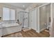 Bright bathroom with a large shower, a soaking tub, and modern fixtures at 741 Monroe Hill Pl, Henderson, NV 89011