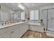 Bathroom with a large soaking tub, a glass-enclosed shower, and double vanity sinks at 741 Monroe Hill Pl, Henderson, NV 89011