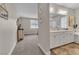 Elegant primary bathroom featuring dual sinks, a soaking tub, and neutral tones at 741 Monroe Hill Pl, Henderson, NV 89011