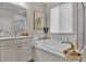 Soaking tub in a spacious primary bathroom with modern fixtures and window with blinds at 741 Monroe Hill Pl, Henderson, NV 89011