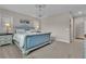 Bright and airy bedroom with plush carpeting and a decorative ceiling fixture at 741 Monroe Hill Pl, Henderson, NV 89011