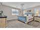 Bedroom featuring an elegant bed frame and a decorative chandelier at 741 Monroe Hill Pl, Henderson, NV 89011