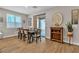 Elegant dining space with a long wooden table and decor, seamlessly blending into a modern home design at 741 Monroe Hill Pl, Henderson, NV 89011