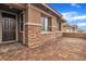 Covered front porch featuring stone accents and a brick-paved walkway to the front door at 741 Monroe Hill Pl, Henderson, NV 89011