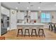 Modern kitchen with a central island, stainless steel appliances, and a seamless connection to the dining space at 741 Monroe Hill Pl, Henderson, NV 89011
