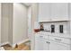 Coffee bar with white cabinetry and quartz countertop at 741 Monroe Hill Pl, Henderson, NV 89011
