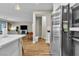 Open-concept kitchen with stainless steel appliances at 741 Monroe Hill Pl, Henderson, NV 89011