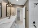 This bathroom features a shower, a mirror, a single vanity sink, and modern design at 9 Cozy Glen Cir, Henderson, NV 89074