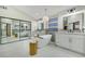 Bright main bathroom with double vanities, a modern soaking tub, and a glass-enclosed shower at 9 Cozy Glen Cir, Henderson, NV 89074