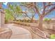 Landscaped backyard features mature trees and a winding walkway at 9425 San Laguna Ct # 102, Las Vegas, NV 89134