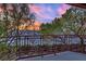 Exterior balcony view overlooking greenery and city lights at 9425 San Laguna Ct # 102, Las Vegas, NV 89134