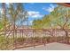 Balcony view overlooking a well-maintained landscape with trees and a street at 9425 San Laguna Ct # 102, Las Vegas, NV 89134
