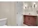 Cozy powder room with custom vanity and decorative lighting at 9425 San Laguna Ct # 102, Las Vegas, NV 89134