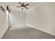 Bedroom with neutral carpet, ceiling fan, and window with custom blinds at 9425 San Laguna Ct # 102, Las Vegas, NV 89134