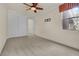 Carpeted bedroom featuring a ceiling fan, closet, and window providing natural light at 9425 San Laguna Ct # 102, Las Vegas, NV 89134