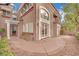 A lovely patio area featuring double doors and arched windows at 9425 San Laguna Ct # 102, Las Vegas, NV 89134