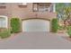 Attached garage and driveway with manicured landscaping and well maintained exterior at 9425 San Laguna Ct # 102, Las Vegas, NV 89134