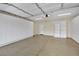 Spacious two car garage featuring built-in storage cabinets and epoxy flooring, ready for customization at 9425 San Laguna Ct # 102, Las Vegas, NV 89134