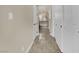 Hallway with view to bathroom with tub and tile surround at 9425 San Laguna Ct # 102, Las Vegas, NV 89134