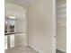 Hallway with tile floors leading into a living space with French doors at 9425 San Laguna Ct # 102, Las Vegas, NV 89134