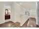 Second floor hallway with hardwood floors leads to bathroom and bedroom at 9425 San Laguna Ct # 102, Las Vegas, NV 89134