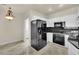 Modern kitchen with white cabinets, black granite countertops, and stainless steel appliances at 9425 San Laguna Ct # 102, Las Vegas, NV 89134