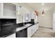 Kitchen with black granite countertops and stainless steel appliances at 9425 San Laguna Ct # 102, Las Vegas, NV 89134
