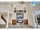 An open living area features a stone fireplace and large windows for viewing the property at 9425 San Laguna Ct # 102, Las Vegas, NV 89134
