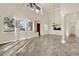 Bright living room with natural light, soaring ceilings and gorgeous chandeliers at 9425 San Laguna Ct # 102, Las Vegas, NV 89134