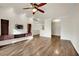 Spacious living area with beautiful hardwood floors, built-in shelves, and an open layout perfect for entertaining at 9425 San Laguna Ct # 102, Las Vegas, NV 89134