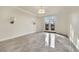 Open living room area with decorative lighting and double doors leading to patio at 9425 San Laguna Ct # 102, Las Vegas, NV 89134