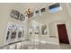Bright living room featuring high ceilings, large windows, and backyard access at 9425 San Laguna Ct # 102, Las Vegas, NV 89134