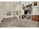 Spacious living room boasts high ceilings, marble floors, and an elegant fireplace at 9425 San Laguna Ct # 102, Las Vegas, NV 89134