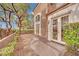A backyard patio area with double doors and a landscaped yard at 9425 San Laguna Ct # 102, Las Vegas, NV 89134