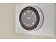 Close-up of a Nest smart thermostat featuring energy-saving settings and modern design at 9425 San Laguna Ct # 102, Las Vegas, NV 89134