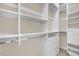 Spacious walk-in closet featuring shelving and drawer systems for organized clothing and accessory storage at 9425 San Laguna Ct # 102, Las Vegas, NV 89134