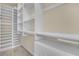 Custom walk-in closet with adjustable shelving and drawers providing ample storage space at 9425 San Laguna Ct # 102, Las Vegas, NV 89134