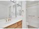 Bright bathroom featuring a vanity with wooden cabinets and white countertop, toilet, and a shower and tub combination at 9704 Brawley Dr, Las Vegas, NV 89134